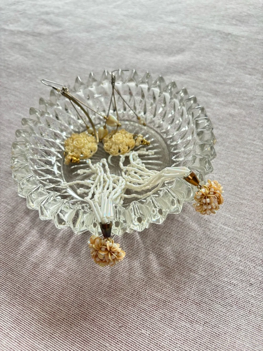 Set of three vintage cream earrings.